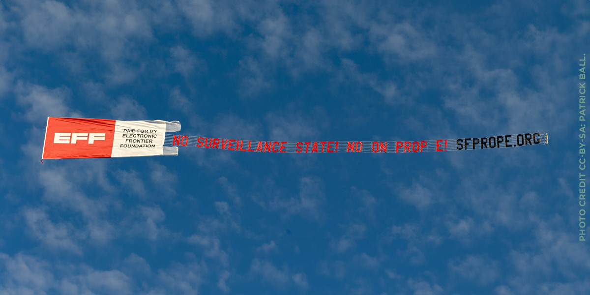 Banner flying over san francisco asking people to vote no on prop E