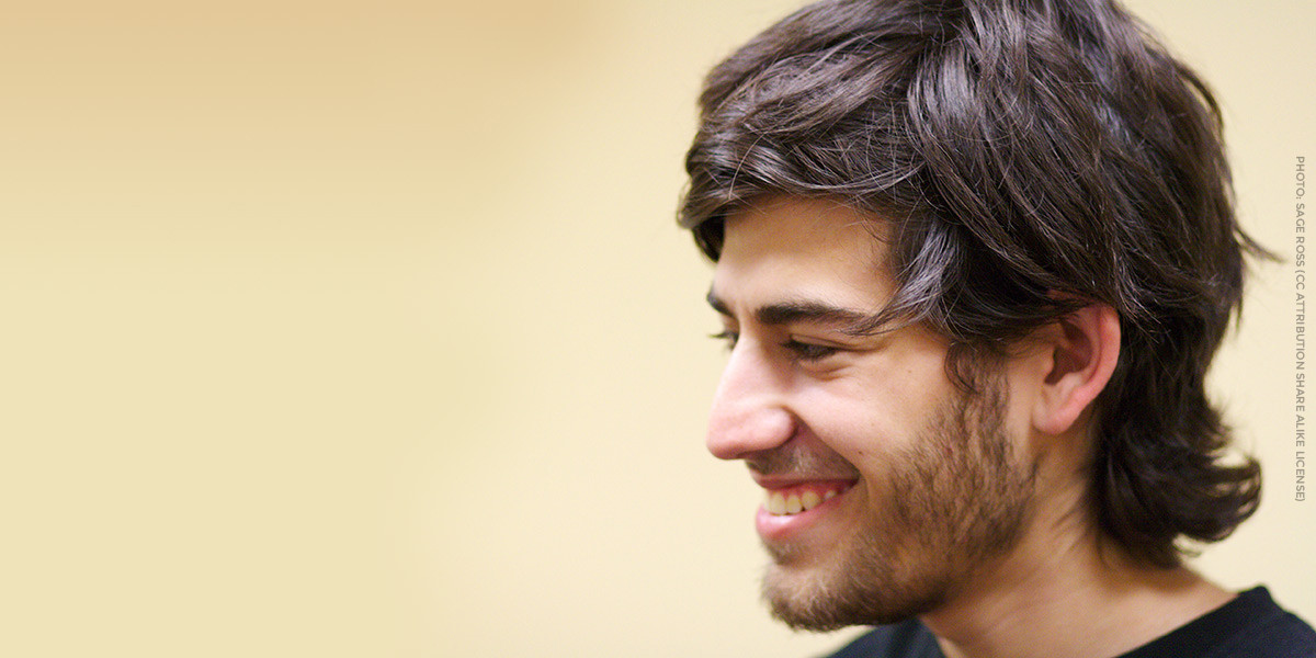 A photo of Aaron Swartz smiling.