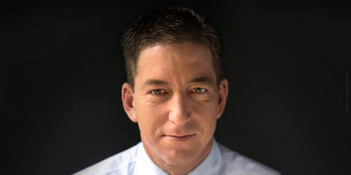 Portrait of Glenn Greenwald against a dark background. Photo by David dos Dantos CC-BY