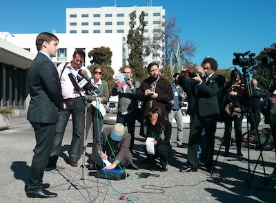 EFF's Trevor Timm speaks to assembled reporters in front of the Alameda County Administration Building.